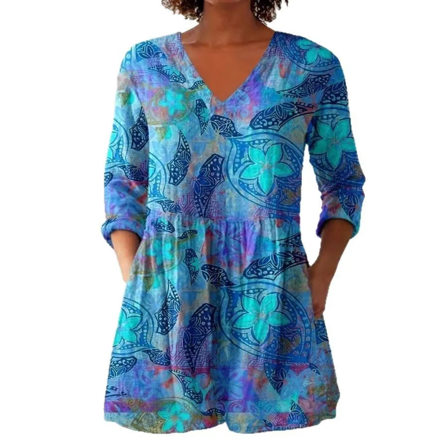 Women's retro-style slim-fit long-sleeved top with a colourful digital print pattern, shown on a model.
