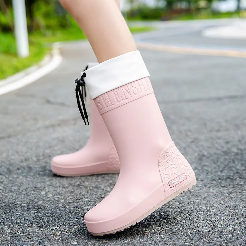 Women's solid colour PVC rain boots in apricot, black, brown, or pink with non-slip wear-resistant design