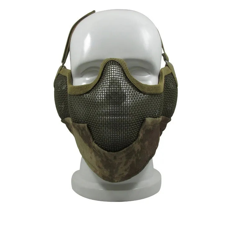 Carbon steel field protective mask with head mount in camouflage pattern, shown with attached mouth muffler.