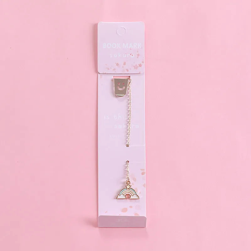 Alloy metal bookmark with cartoon pendant designs including panda, rocket and unicorn variations