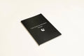 Black hardback A5 dream journal notebook with debossed title on soft-touch cover.