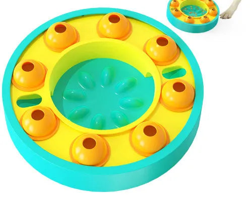 Square green dog puzzle toy with a central feeding well and a rotating turntable lid on a hard floor.