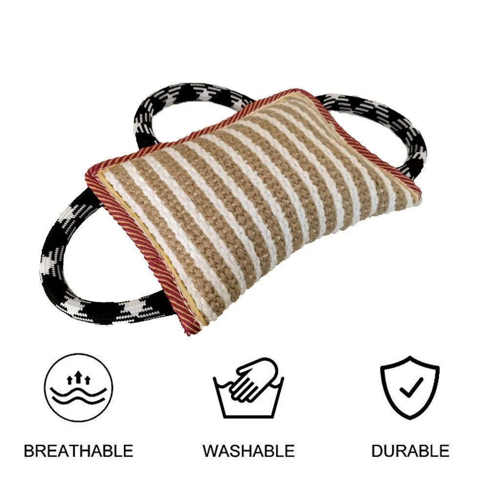Jute dog tug toy with three rope handles in assorted colours on a neutral background.