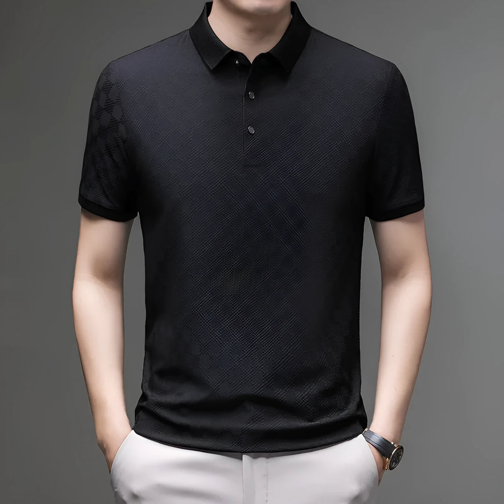 Man wearing a thin black T-shirt with a rhombus-shaped slit detail on the chest.