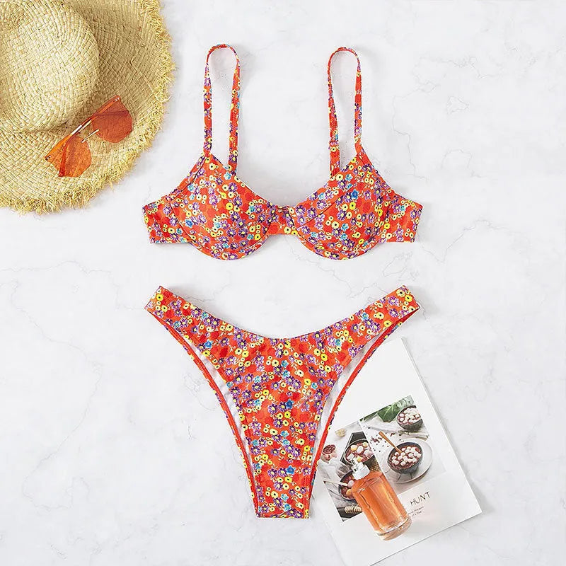 Red women's swimsuit with small floral pattern, high waist design, and side splits on legs