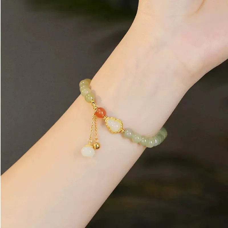 Jade and gold plated women's bracelet with fu character charm and Chinese knot fastening