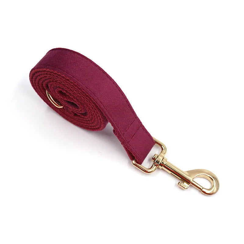 Burgundy velvet pet collar with bow tie and gold engraved clasp, available in sizes XS to XL