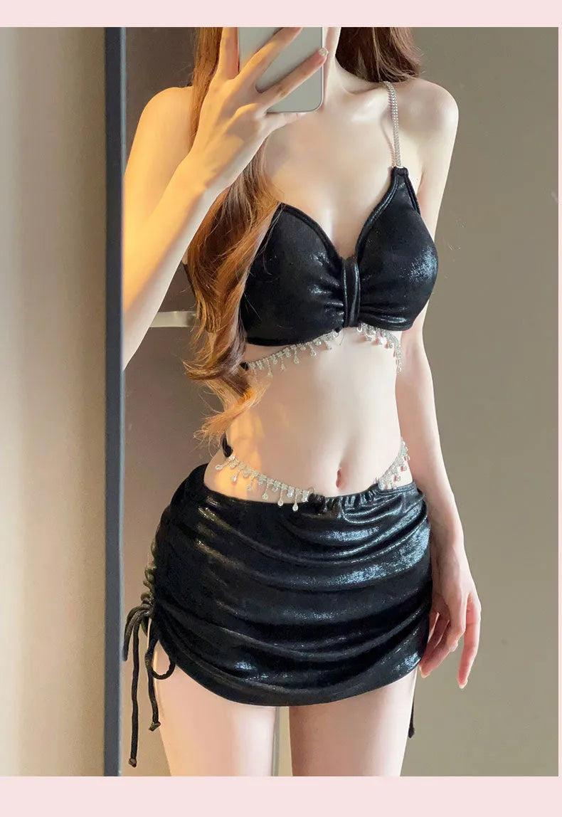 Women's solid colour polyester bikini swimsuit set in black or pink on mannequin