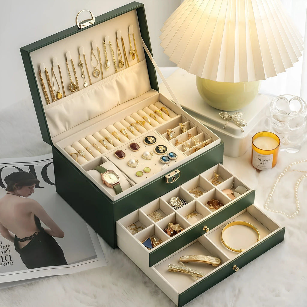 Leather jewellery storage box with three drawers open showing removable dividers and satin lining in four colour options