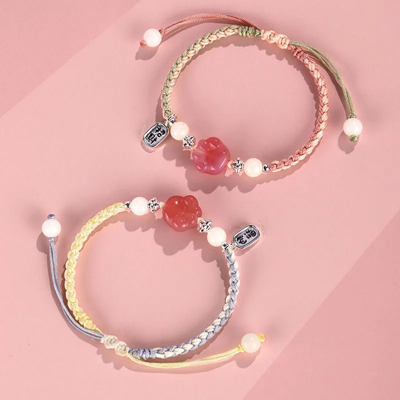 Handmade red cat's paw charm bracelet woven with pink or yellow glass beads in a pastoral couple's style.
