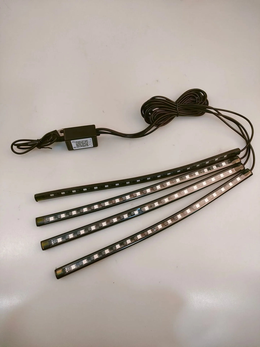 Car footwell LED atmosphere lighting strips with smartphone APP control showing eight colour options