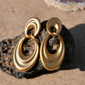 Gold French retro earrings with double circle design on U-shaped copper hoops