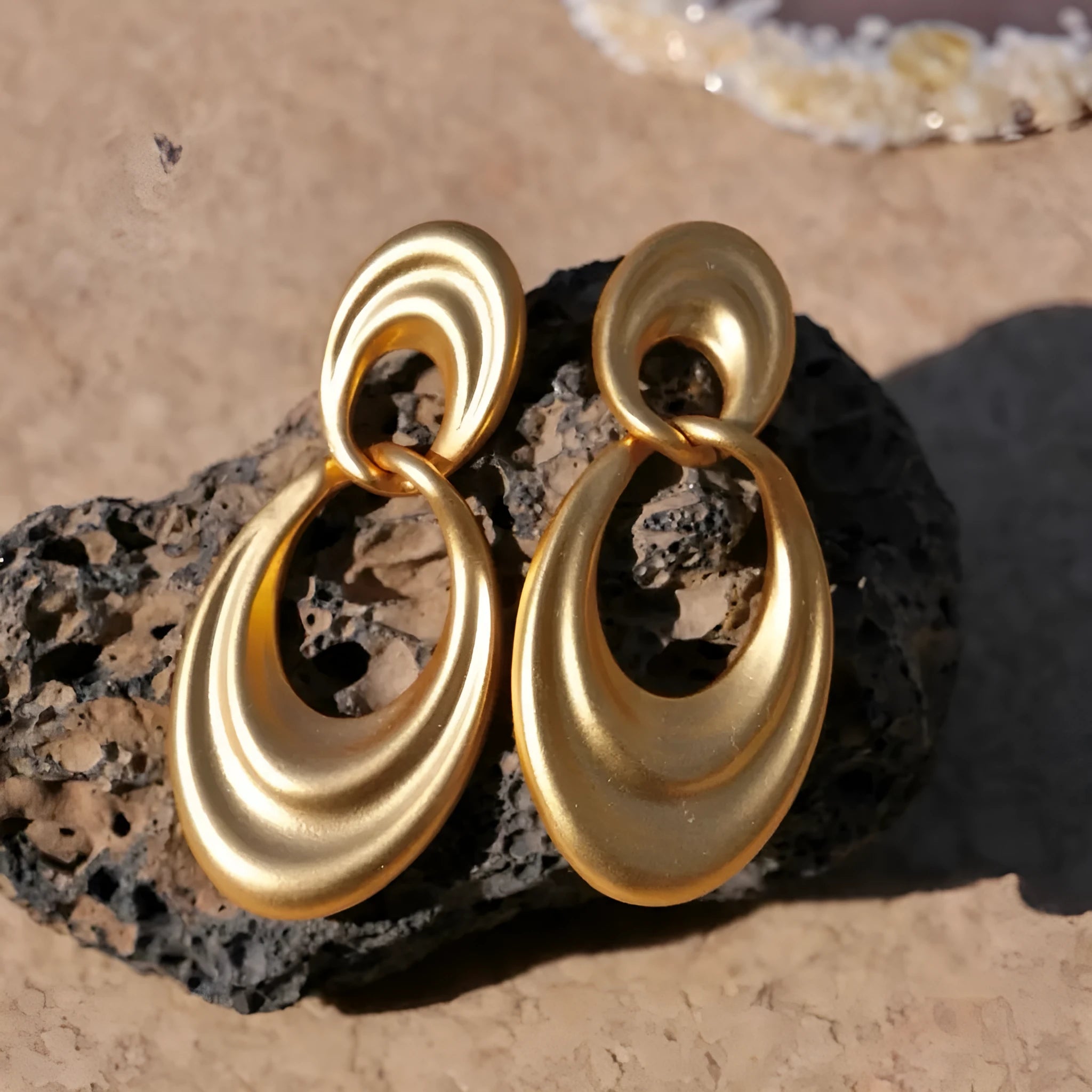 Gold French retro earrings with double circle design on U-shaped copper hoops