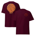 Men's maroon polyester mesh short-sleeved t-shirt with a ball pattern, laid flat.