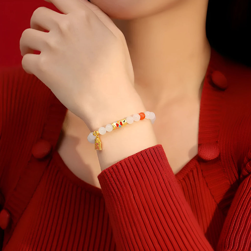 S925 sterling silver bracelet with a blue cold enamel and natural Hetian jade koi fish charm.