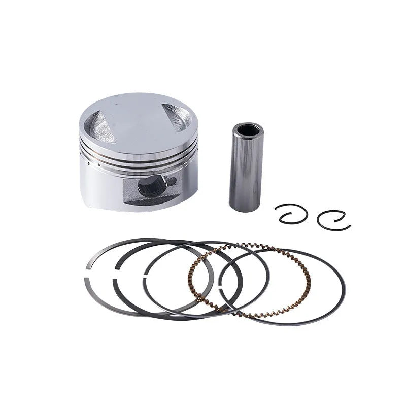 Motorcycle engine piston kit showing aluminium piston, rings, and pin for 57.4mm cylinder diameter