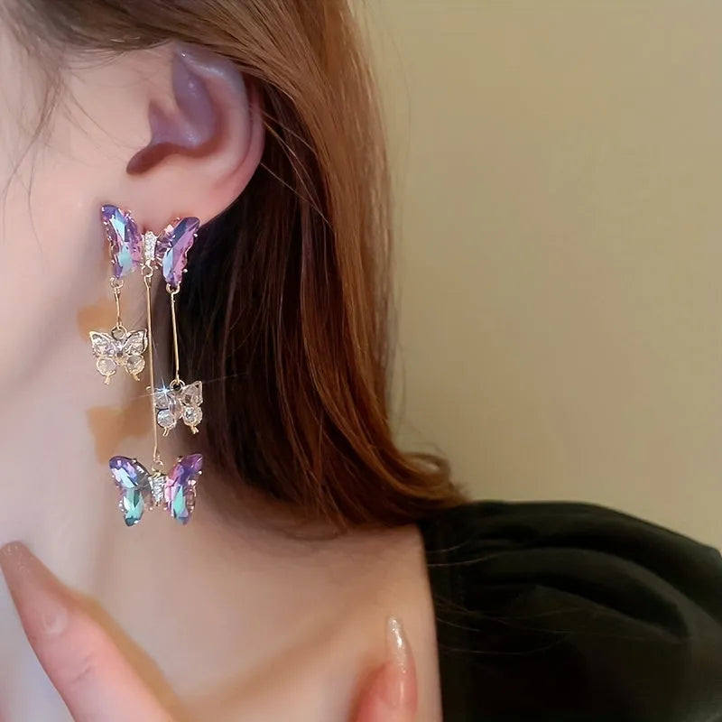 Silver Needle Crystal Flowers Butterfly Tassel Earrings in blue purple with a 5.5cm drop on a hypoallergenic alloy post.