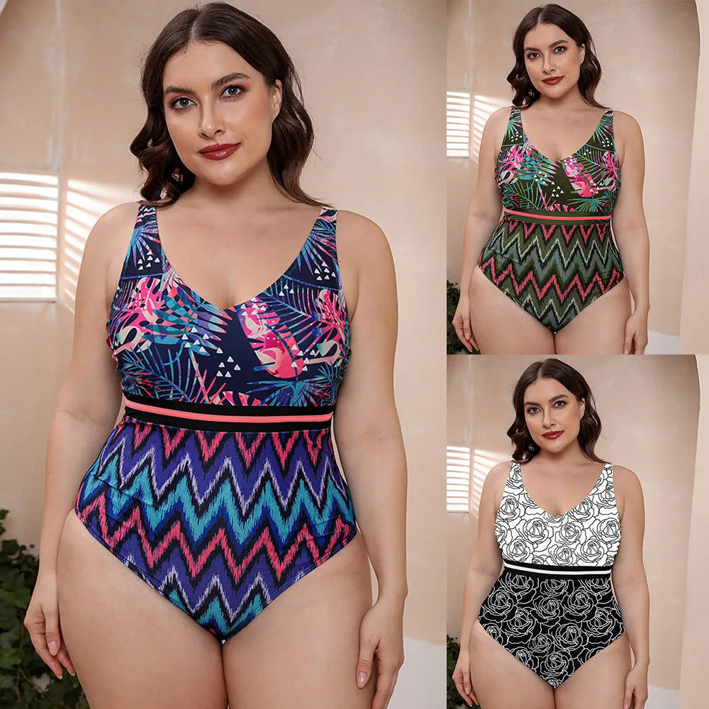 Women's blue printed one-piece swimsuit with spaghetti straps on a mannequin.