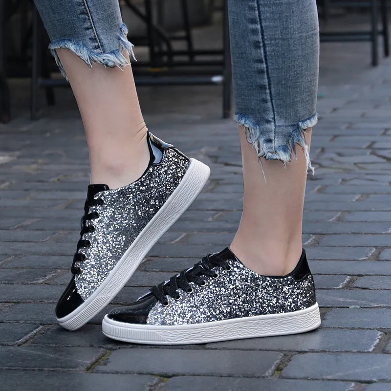 Women's black, pink and gold sequin casual low-top lace-up shoes with round toe and rubber sole.