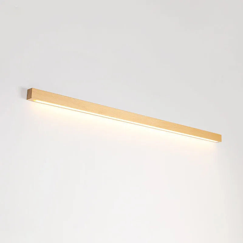 Modern wooden log strip wall lamp mounted on a wall in walnut colour