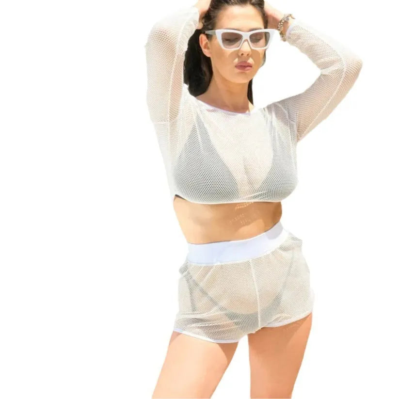 White transparent mesh beach cover-up top with fabric straps and matching skirt laid flat