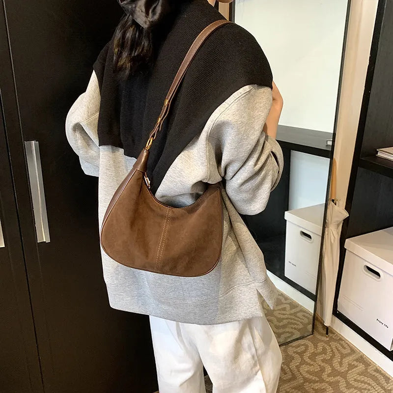 Retro commuter crossbody bag in PU with oval shape and three-dimensional pocket, shown in black, wine red, dark brown, or brown.