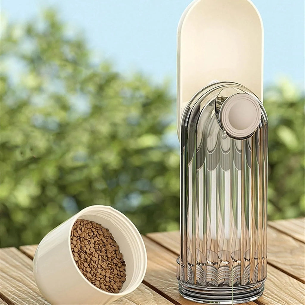 Beige foldable dog water bottle and food dispenser with large drinking opening, shown next to a leash.