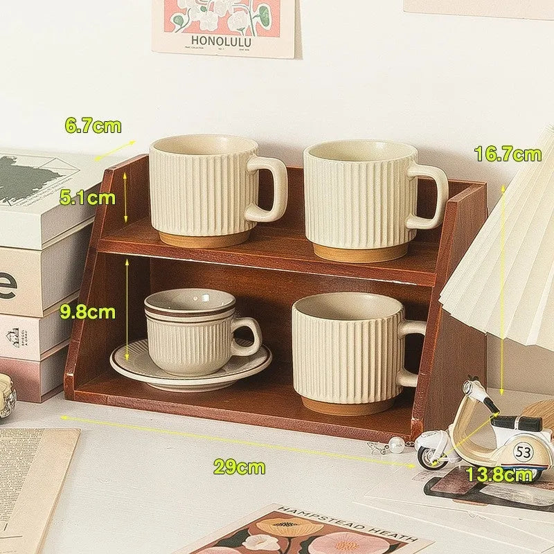 Solid wood multi-layer cup storage box in blue finish, showing two tiers of cups organised neatly on a kitchen counter.