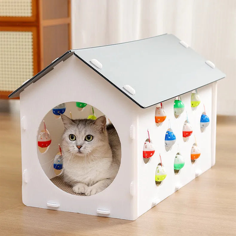White plastic cat scratch board with integrated enclosed nest, tunnel, and hanging bell ball toy.
