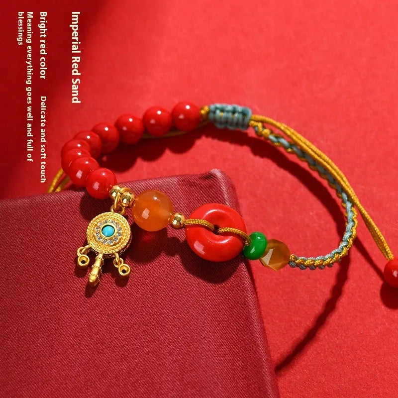 Hand-woven cinnabar peace buckle bracelet in emperor red sand colour with geometric design