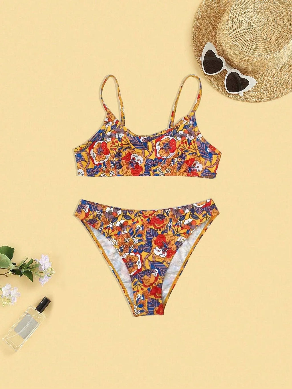 Plus size floral print strapped bikini swimsuit top and briefs on a white background.