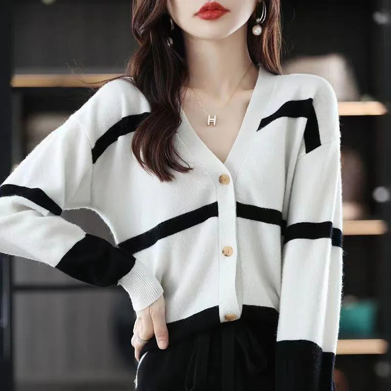 Women's striped V-neck cardigan with a raised 3D pattern, shown buttoned.