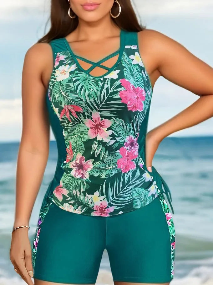 Women's plus size floral high-waist swim bikini in blue on a neutral background.
