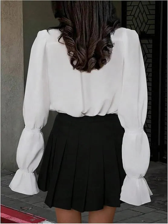 Solid colour polyester women's shirt with lantern sleeves and ruffle detail, available in white, pink, and black