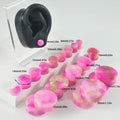 Crystal red flower stone solid expansion earplug on grey background, 6mm to 30mm sizes available, unisex geometric design