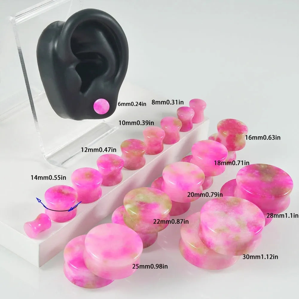 Crystal red flower stone solid expansion earplug on grey background, 6mm to 30mm sizes available, unisex geometric design