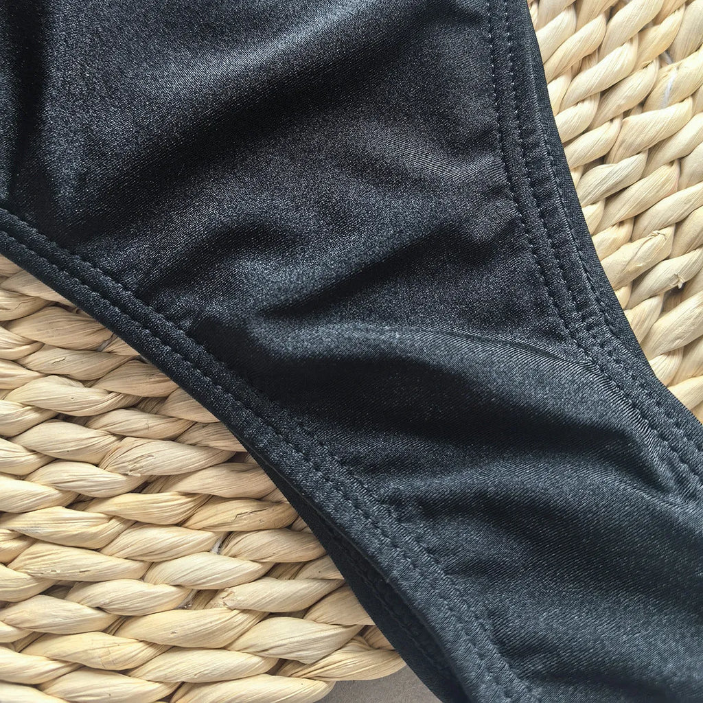Women's solid colour one-piece swimsuit with high elasticity, shown in a European and American bikini style.