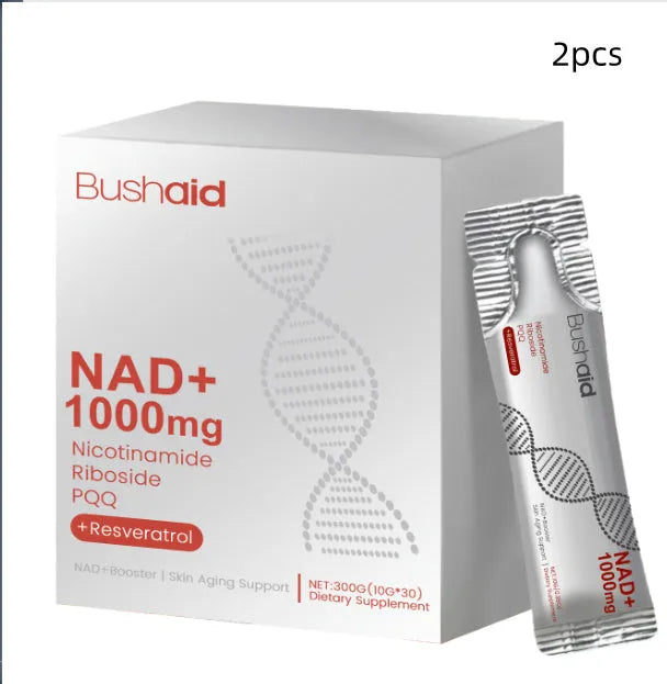 Two single-serve sachets of anti-ageing drink powder with nicotinamide riboside and PQQ on a wooden surface