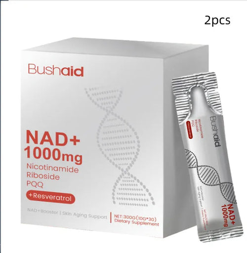 Two single-serve sachets of anti-ageing drink powder with nicotinamide riboside and PQQ on a wooden surface