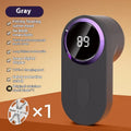 Portable electric clothes fur ball shaver in light gray with blade cover closed, battery-operated lint remover for sweaters