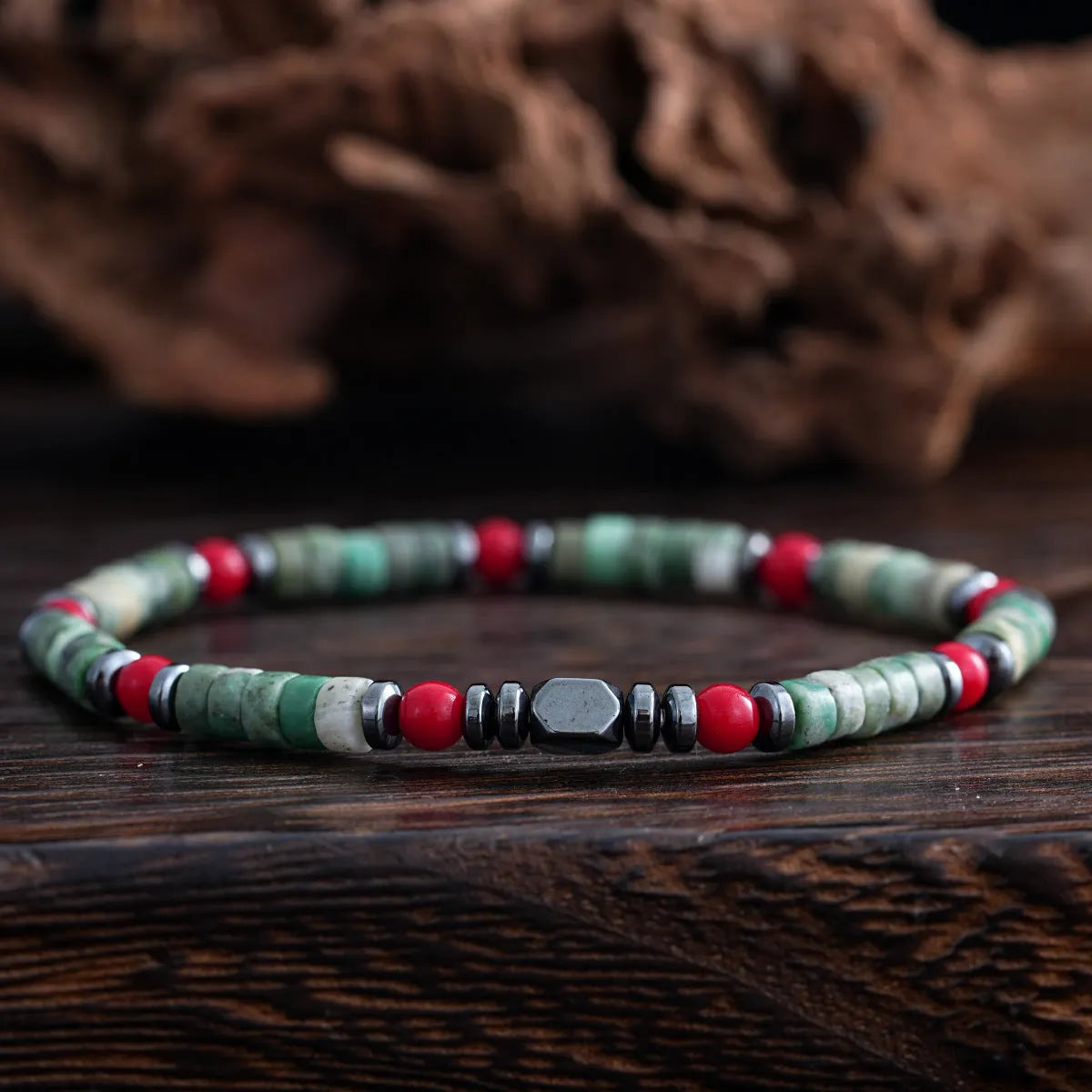 Bohemian men's bracelet with cylindrical natural stone beads on a woven string.