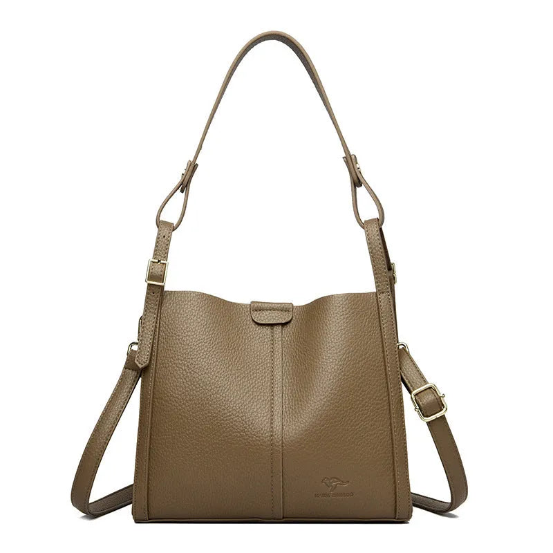 Ladies retro shoulder bag in vertical square shape showing PU material construction and internal compartments