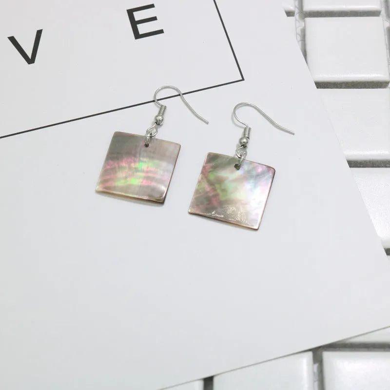 Women's natural shell earrings in geometric square and rectangular shapes with retro styling