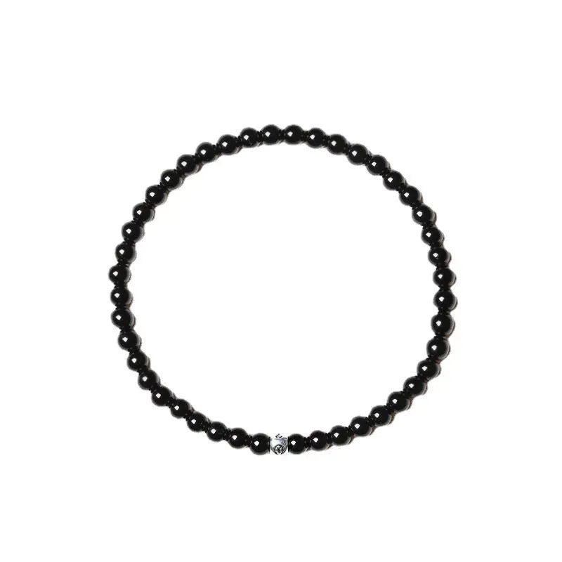 Geometric stone bead bracelet with black agate, blue san, obsidian, and cut surface black agate in chamfered square shapes