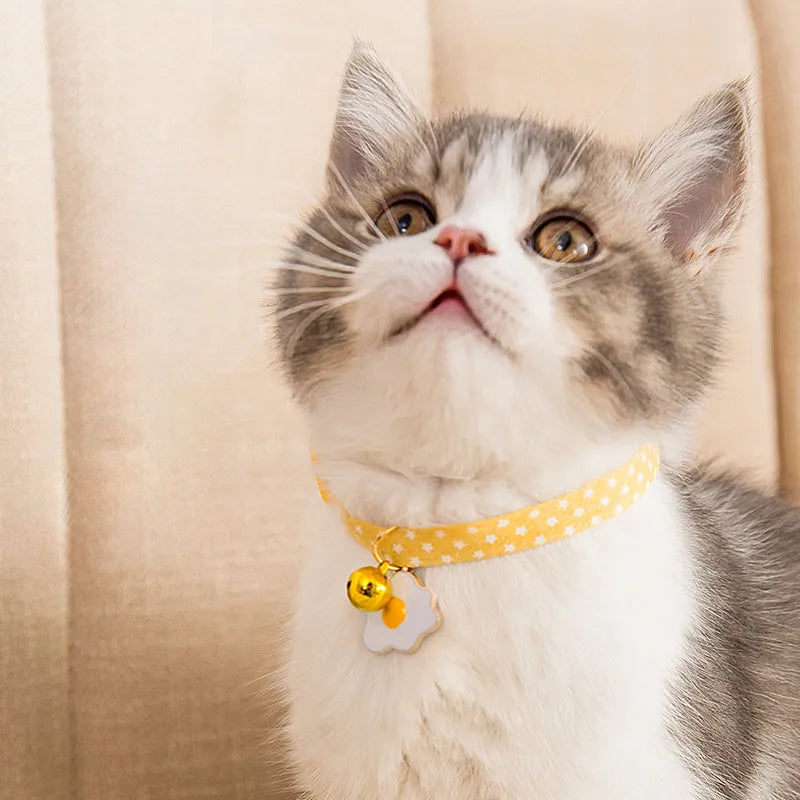 Adjustable cat collar with bell and bow tie for small dogs in green, pink, or yellow.