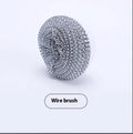 White cordless electric cleaning brush with multiple brush heads on charging dock