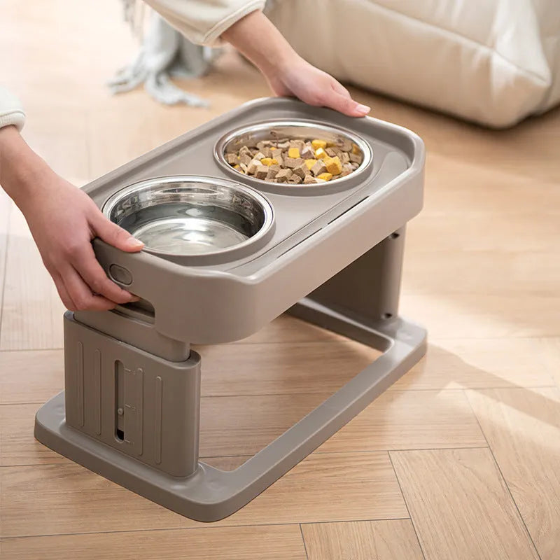 Adjustable elevated pet feeding station with plastic base and two stainless steel bowls in brown colour option