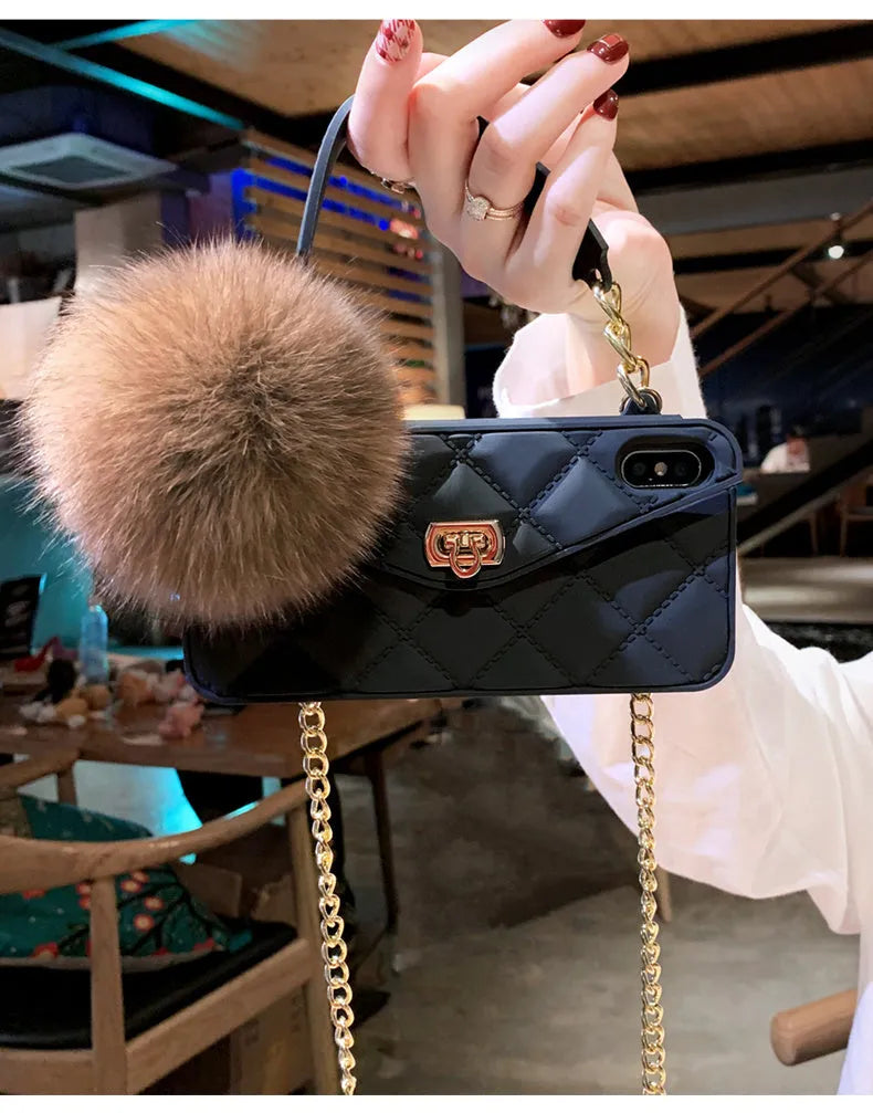 Soft plush hairball phone case with a grid pattern for iPhone, shown in dark green.
