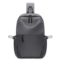 Grey waterproof polyester chest bag for men showing shoulder strap and main compartment