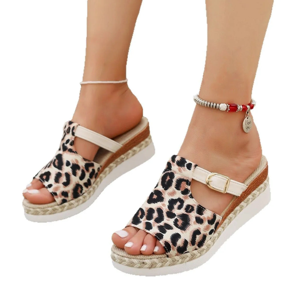 Leopard print women's wedge sandals with a fish mouth toe bracket on a rubber platform sole.